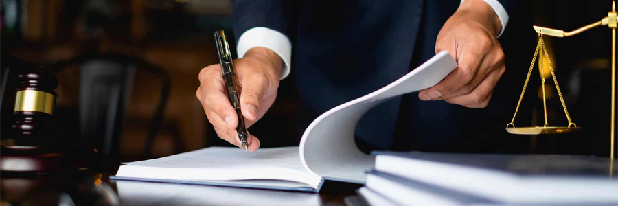 lawyer signing papers